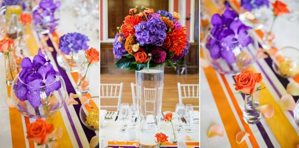 orange and purple wedding flowers on long table