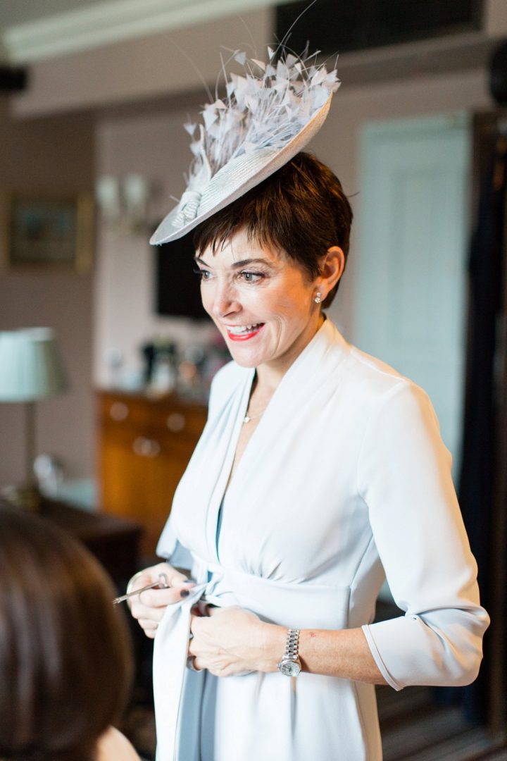 mother of the bride watching her daughtr getting ready for wedding