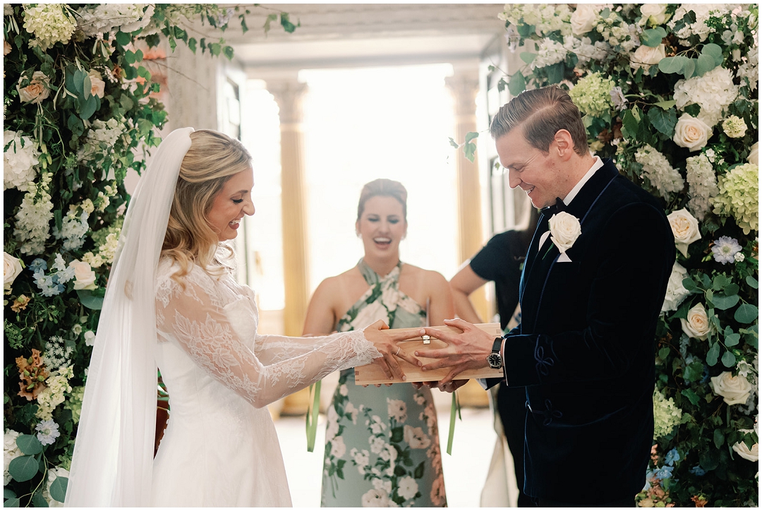 bride and groom perform wine ceremony during wedding at Chiswick House Wedding