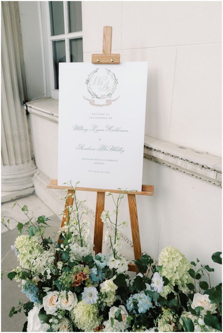 elegant welcome sign with meadow flowers at Chiswick House Wedding