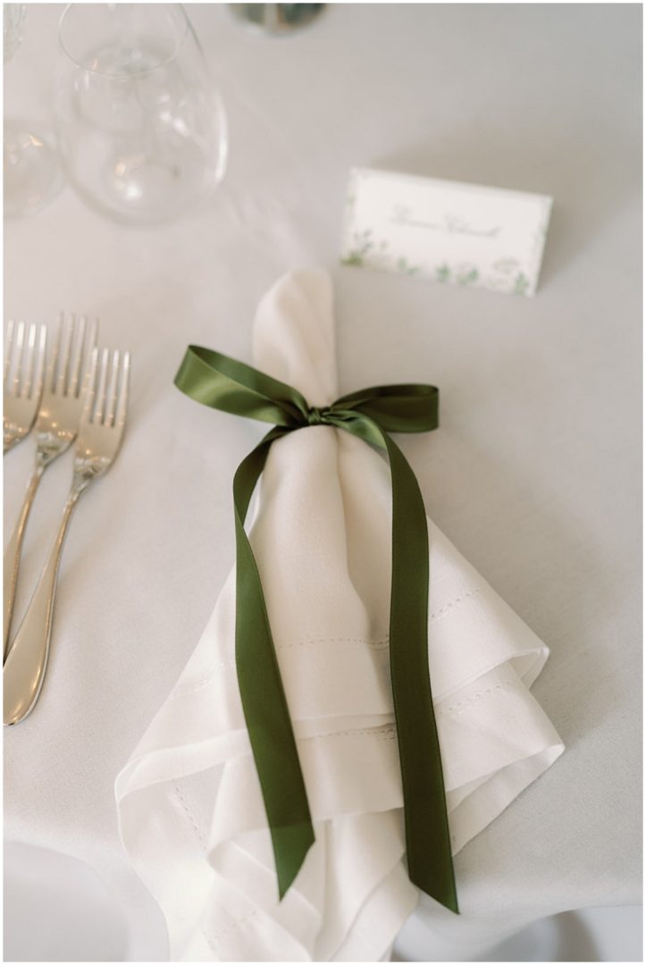 napkin tied with olive green ribbon at Chiswick House Wedding
