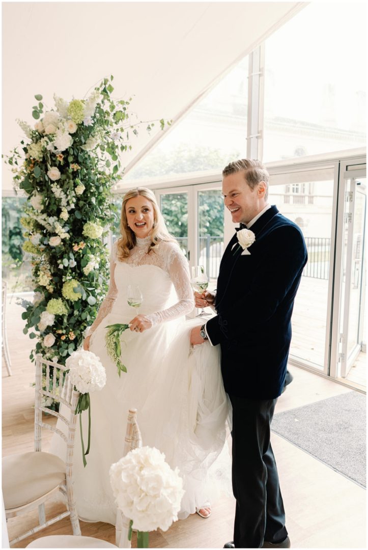 bride and groom enter wedding reception at Chiswick House Wedding