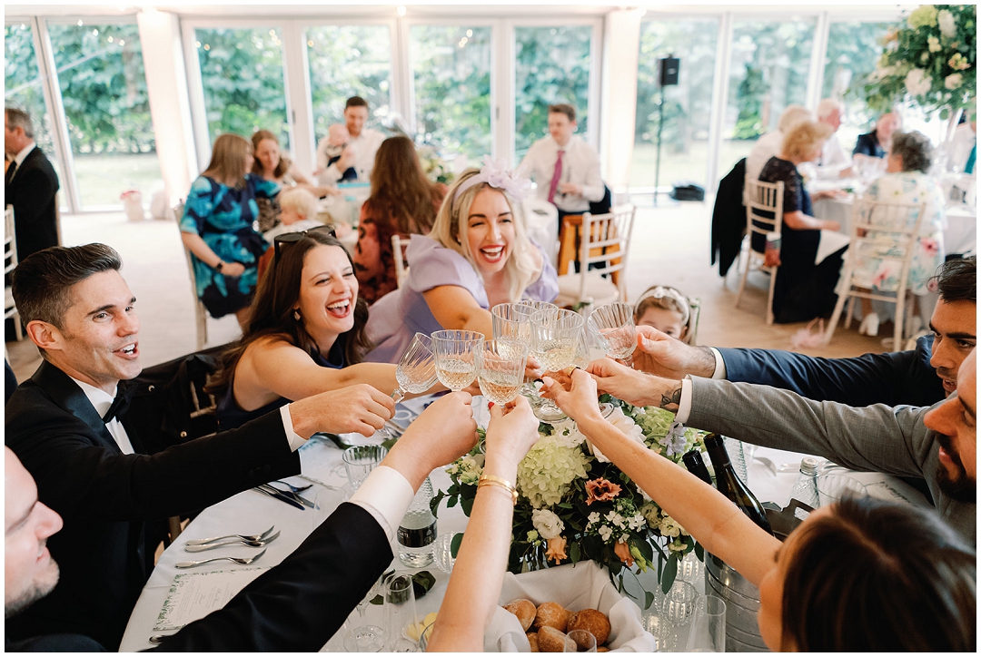 guests toast the happy couple at at Chiswick House Wedding