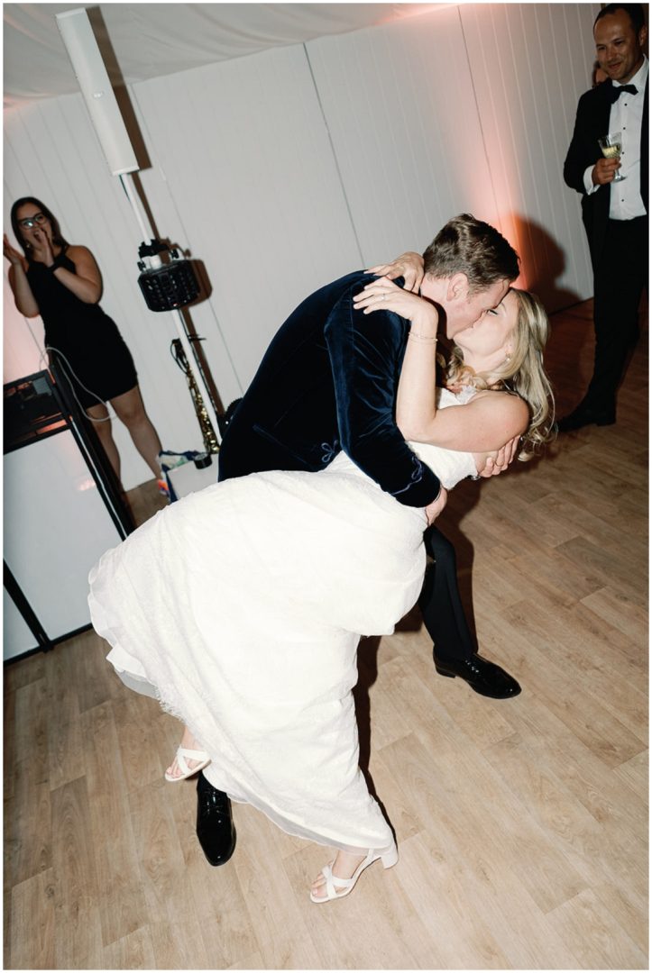bride and groom kiss during first dance at Chiswick House Wedding