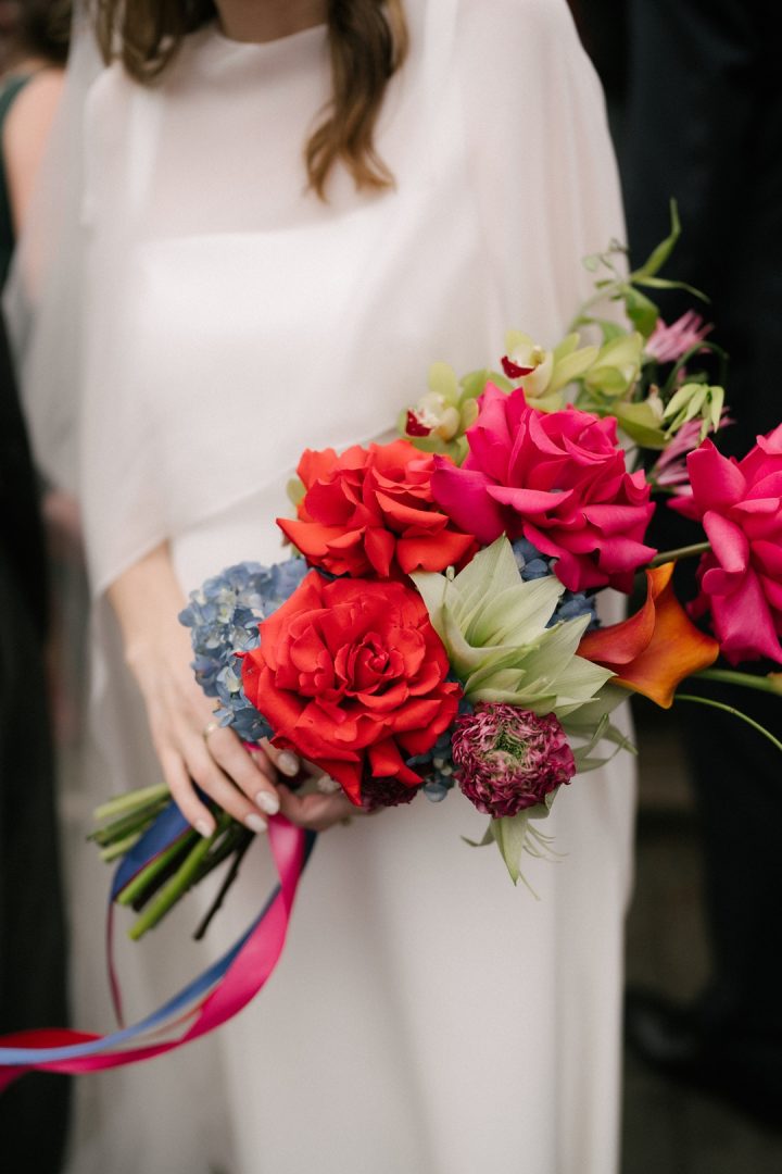 colourful bouquet held by modern bride