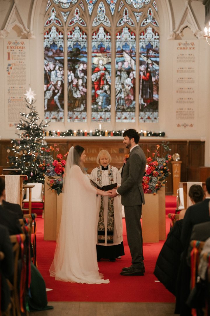 bride and groom holding hands, getting married at church