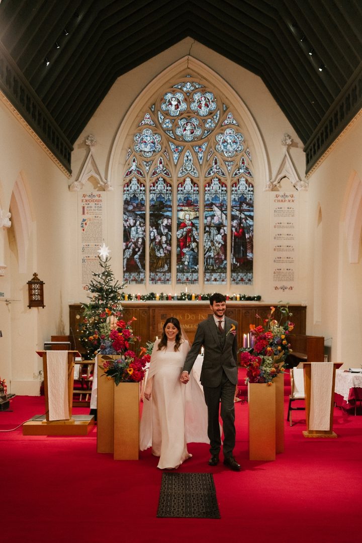 bride and groom prepare to walk down aisle at church wedding Islingotn