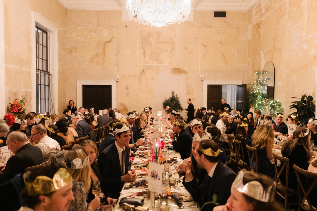 wedding guests at long colourful dining table at Old Sessions House wedding