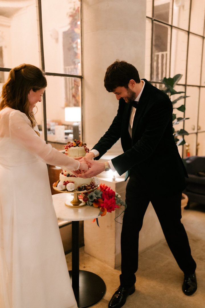 bride and groom cutting wedding cake at Old Sessions House wedding