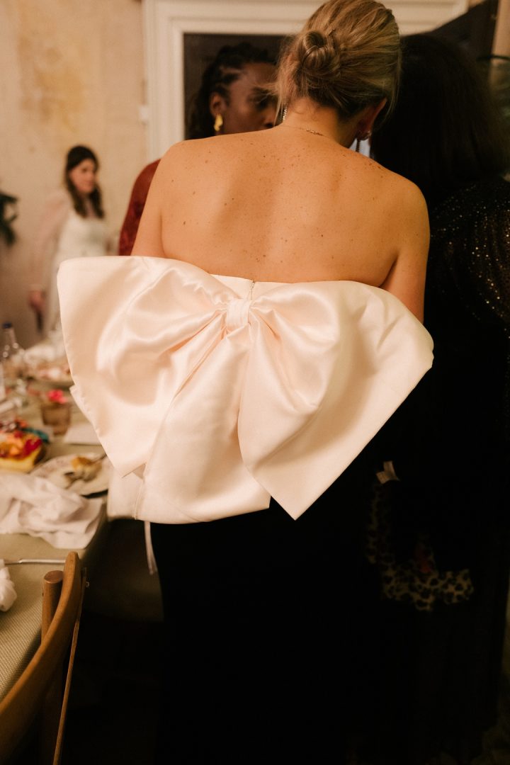 wedding guest large bow on back of dress